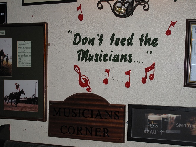 A sign on the wall reads don't feed the musicians. There is another sign under this saying musicians corner.  This is where a session usually takes place but is not where the stage was.