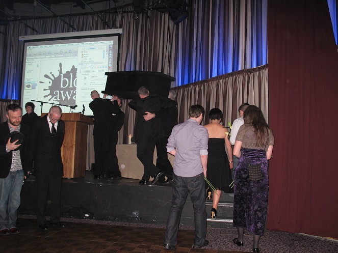 The funeral procession has reached the stage.