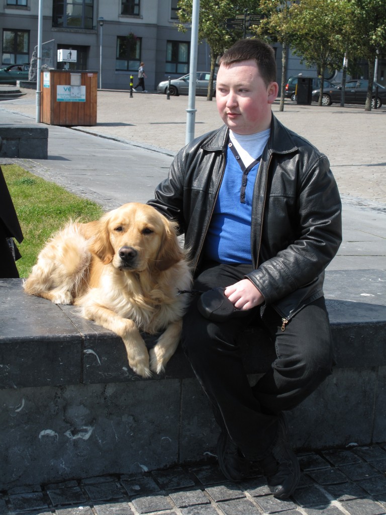 Darragh and Ike sitting on a stone bench near a river at the end of Shop Street in Galway. Darragh and Ike sitting on a stone bench near a river at the end of Shop Street in Galway.